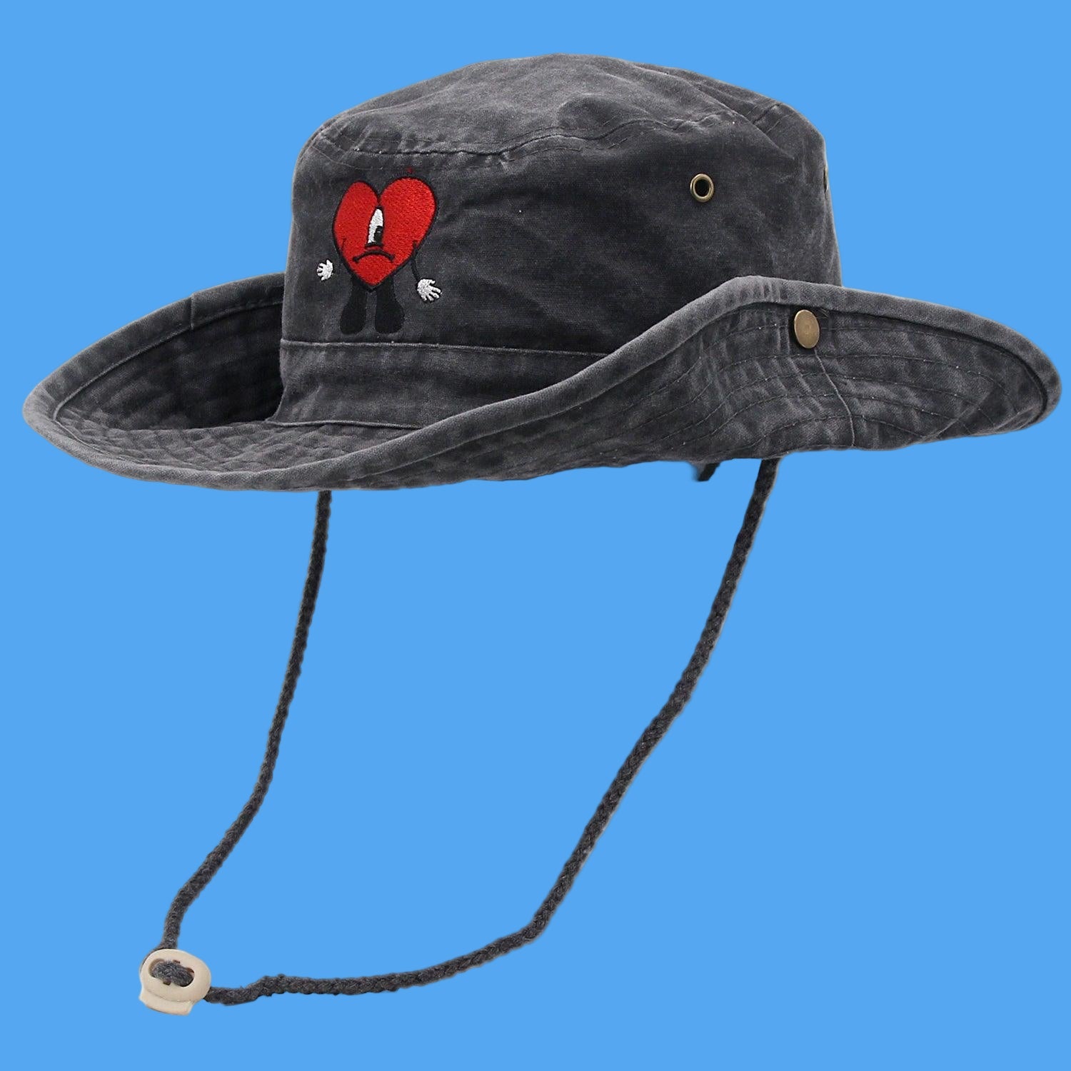 Black bucket hat with a red heart design on a white background
