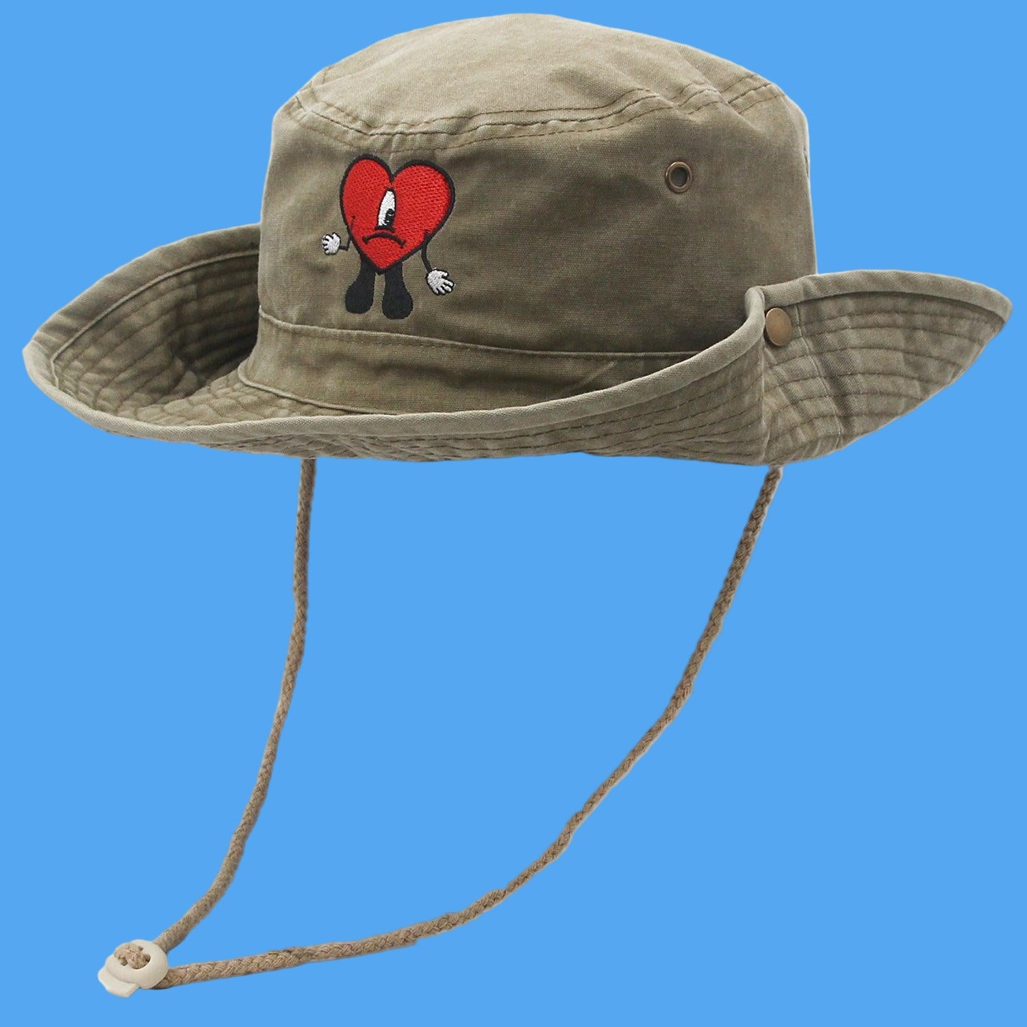 Khaki bucket hat with a red heart design on a white background