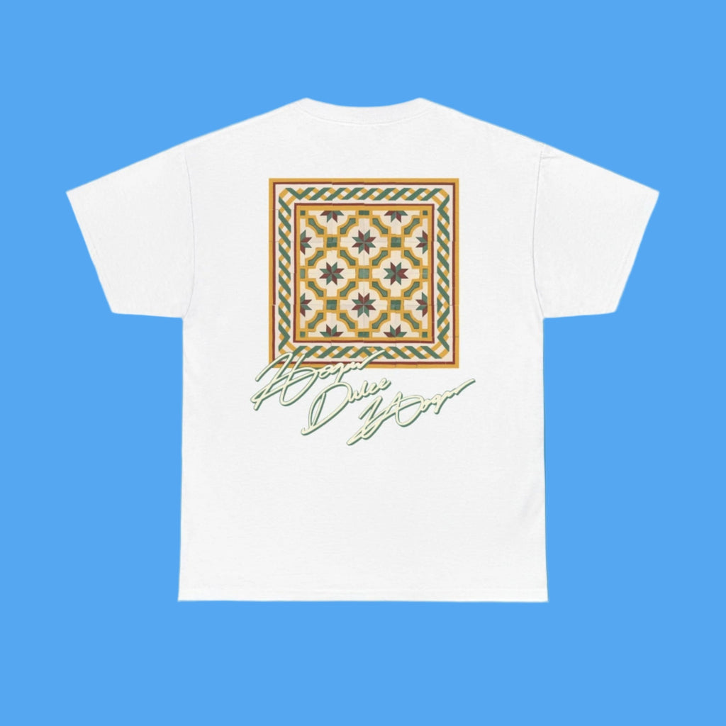 White t-shirt with a decorative pattern and text on a blue background