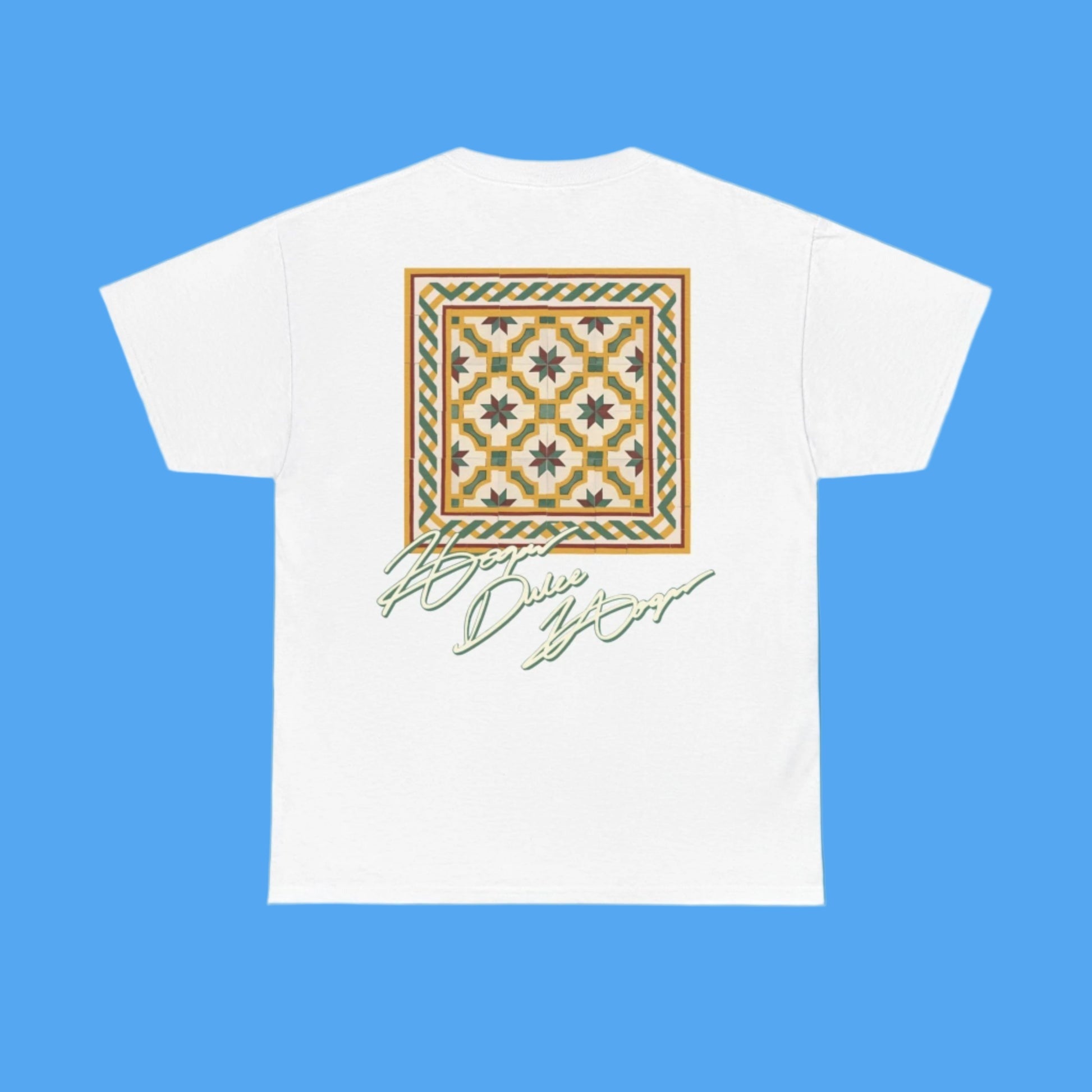 White t-shirt with a decorative pattern and text on a blue background